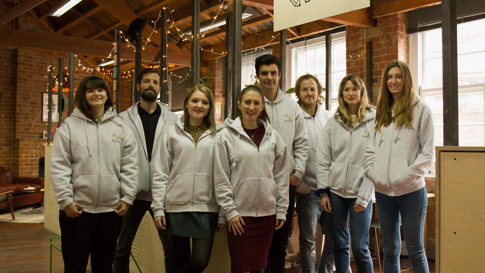 The Boords team, including James Chambers (fifth from left), poses for a picture in their London office. 